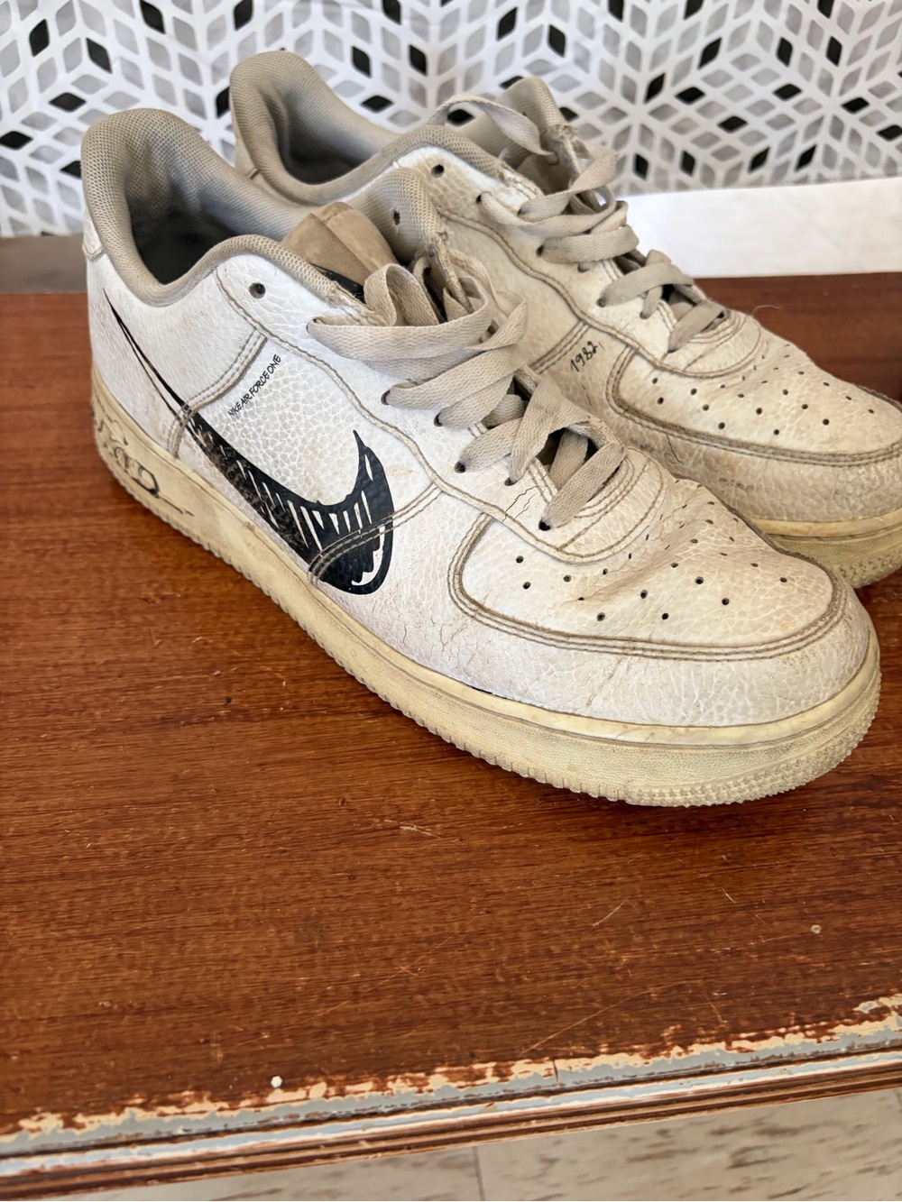 Nike Low-Top Sneakers in Off-White with Black Swoosh